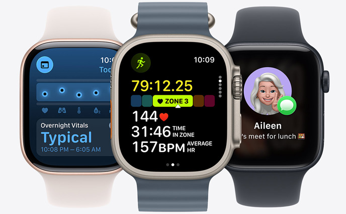 Kolme Apple Watch ‑mallia, keskellä luonnontitaaninen kuori, kellotaulussa näkyy juoksun edistyminen syketiedoilla, oikealla peilimusta kuori, kellotaulussa näkyy genmoji, vasemmalla ruusukullan värinen kuori, kellotaulussa näkyy Elintoiminnot-appi